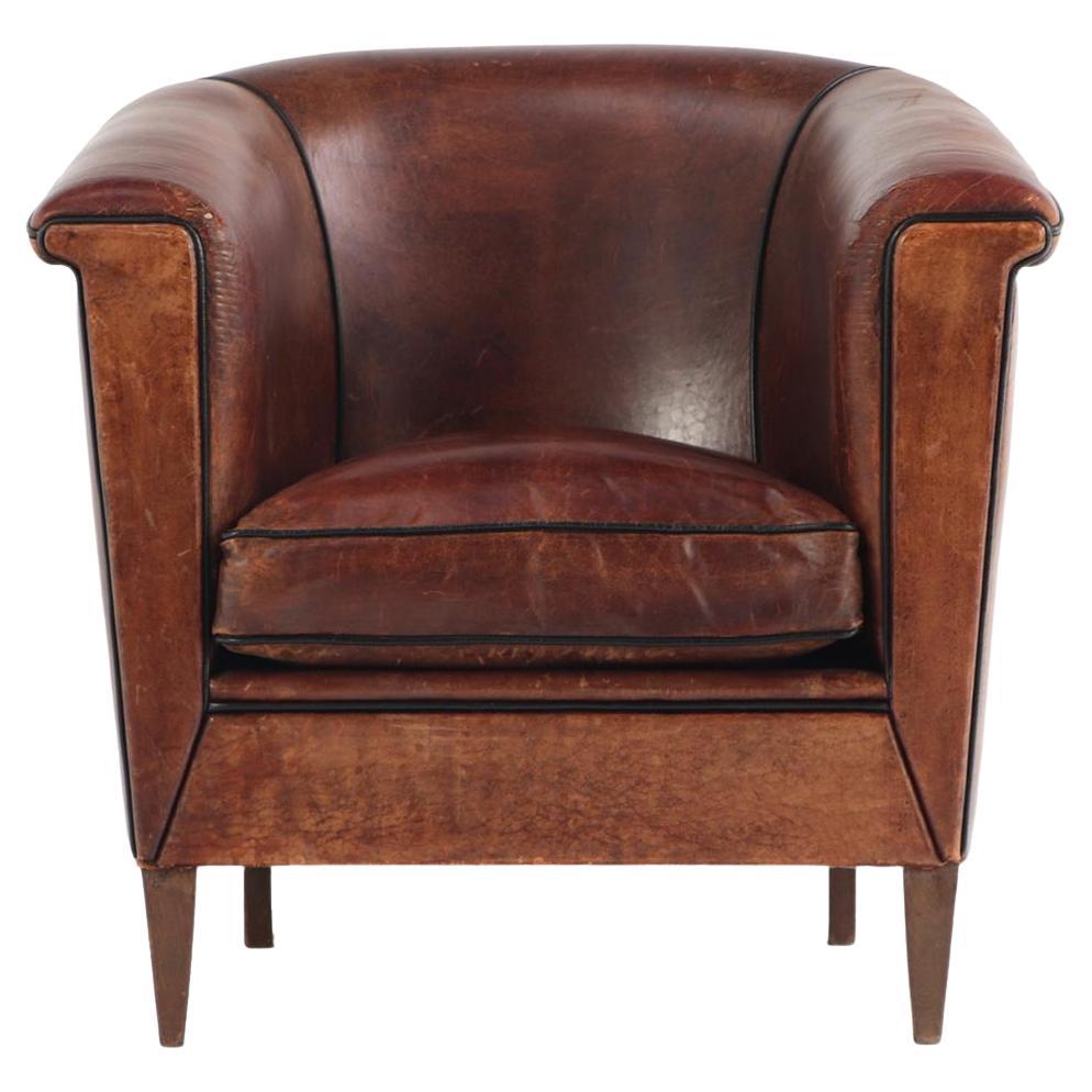 A Dutch Art Deco leather club chair, C 1940.