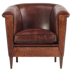 A Dutch Art Deco leather club chair, C 1940.
