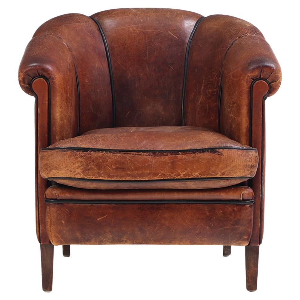A Dutch Art Deco leather club chair, C 1940.