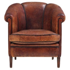 A Dutch Art Deco leather club chair, C 1940.