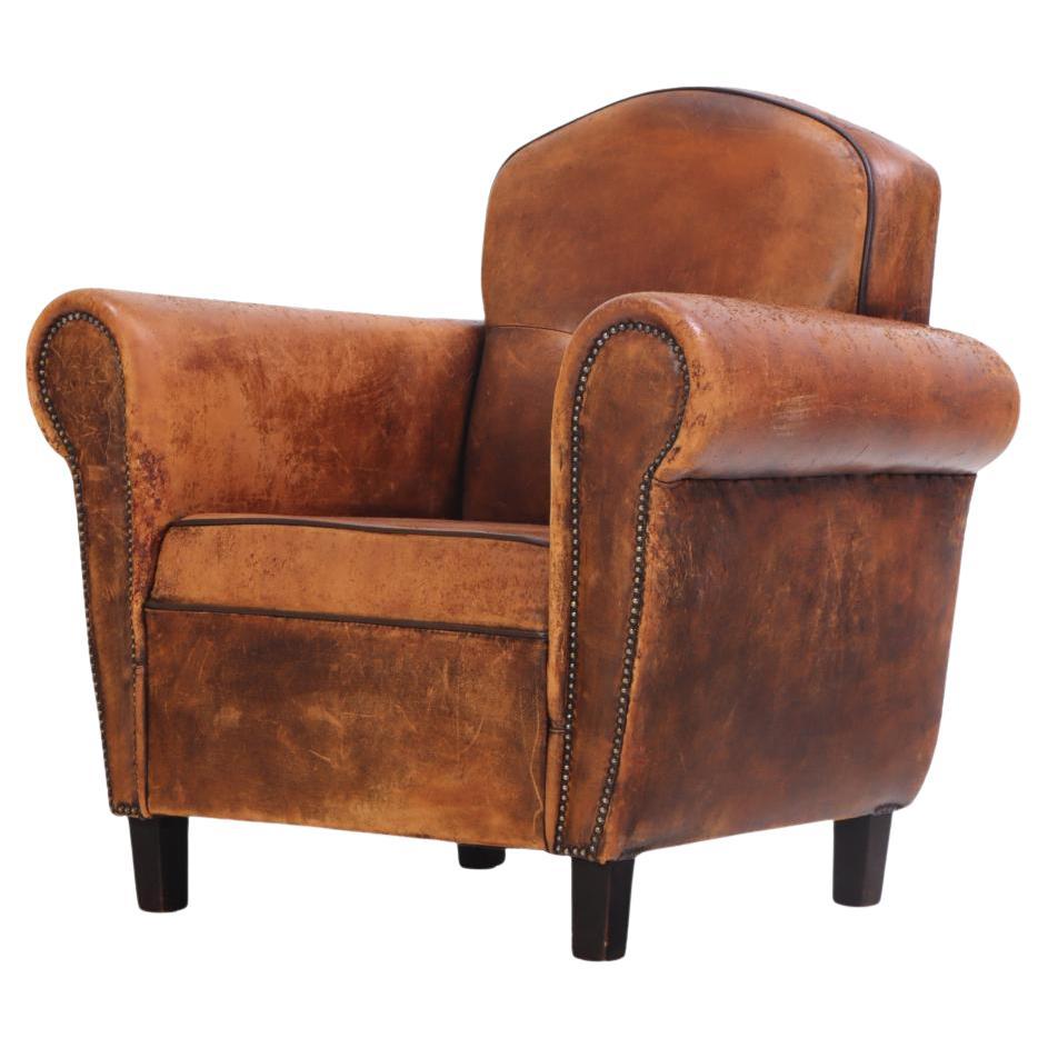 A Dutch Art Deco leather club chair, C 1940. For Sale