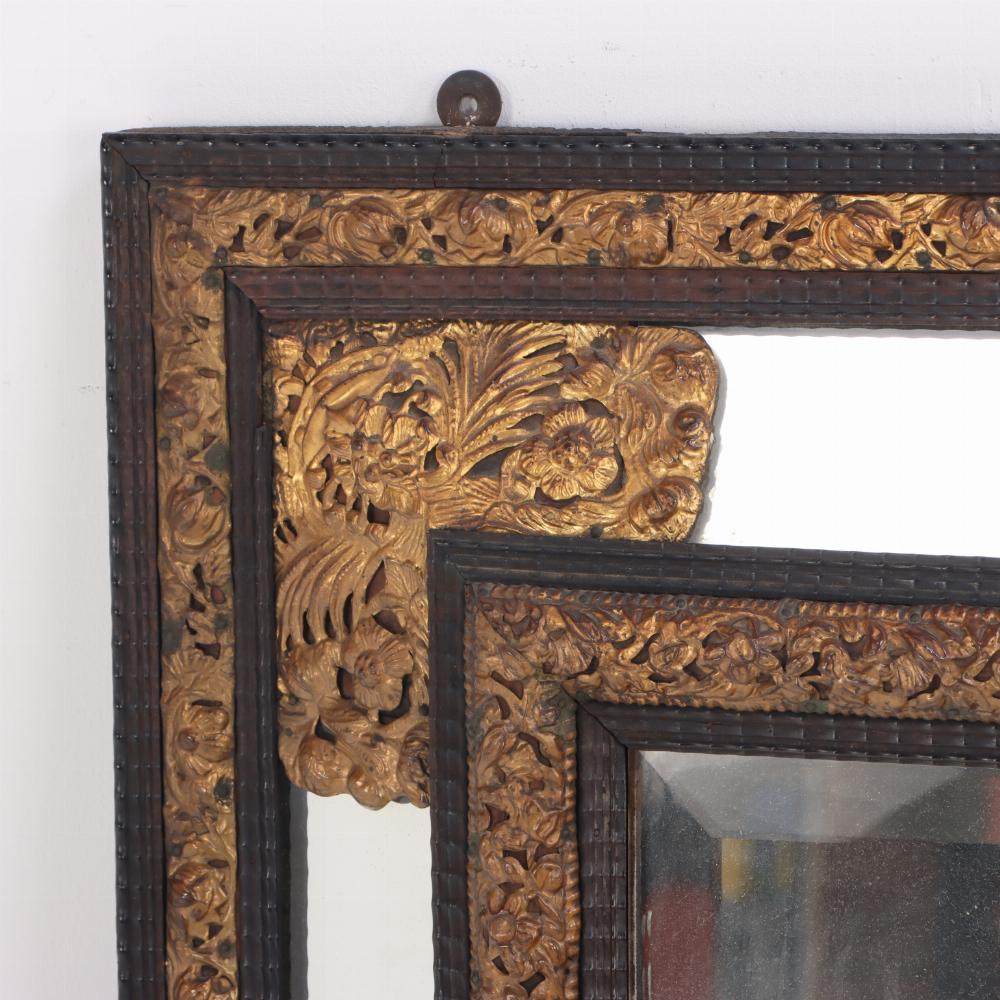 Dutch Colonial A Dutch brass repousse mirror, 19th C.