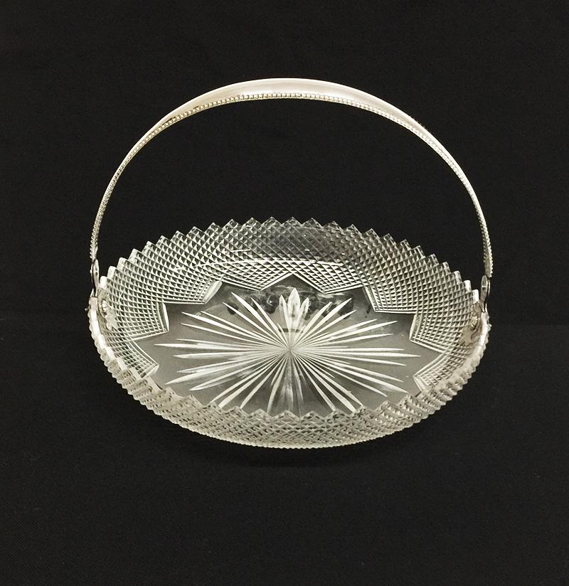 A Dutch crystal with silver fruit bowl, 1917

A crystal fruit bowl with silver handle
The silver handle is marked with Dutch silver marks:
Running lion (2) 835/1000
Minerva head (office mark) with letter A from Amsterdam
The year letter H of the