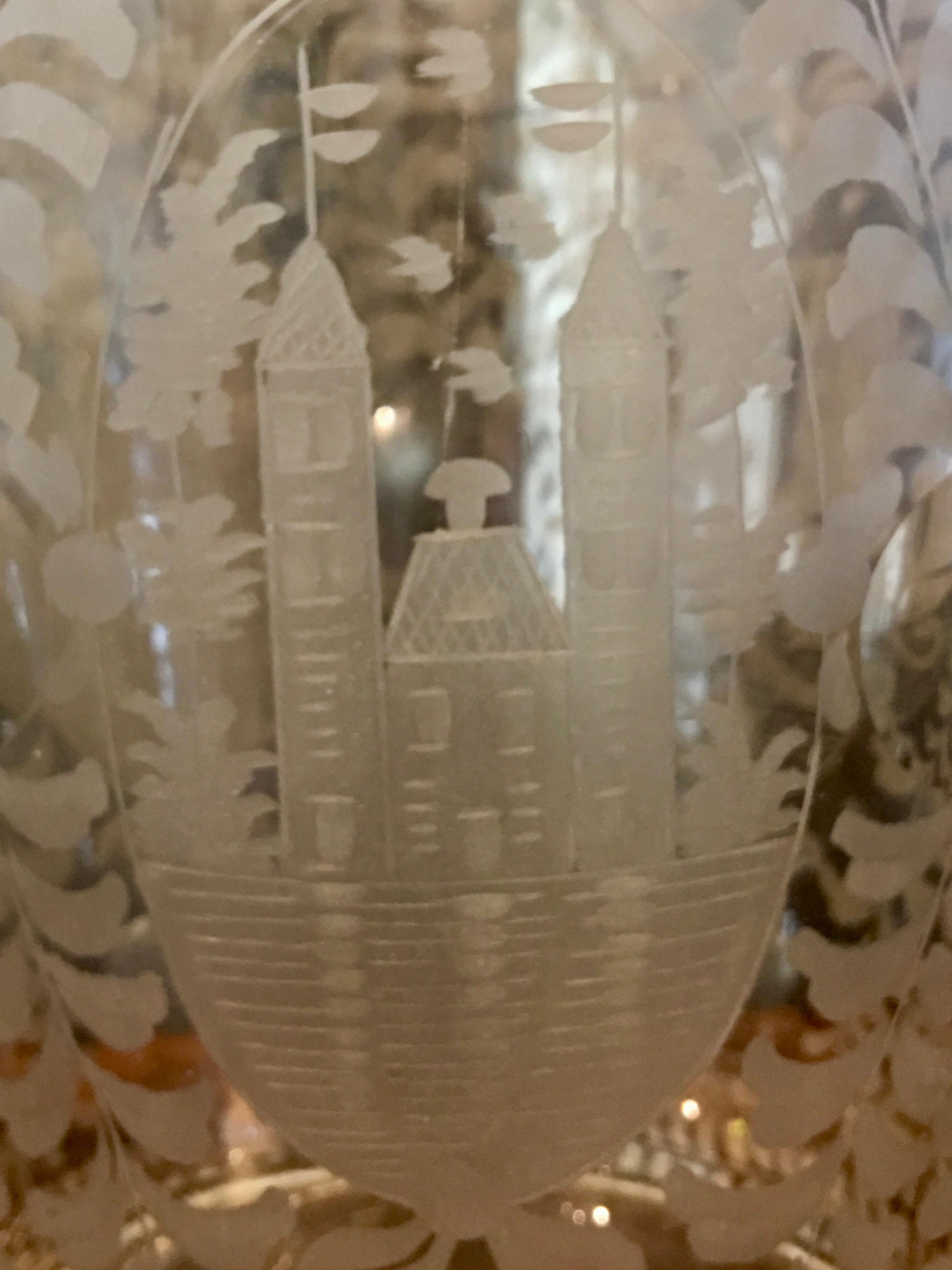 A Dutch large etched glass vase, 19th century
 
This spectacular Crystal Vase is surrounded by finely etched images of a ship, cathedral, leaves, and branches.
  