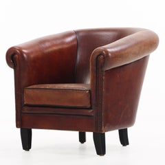 A.I.C., fauteuil club hollandais en cuir, C. 1950.