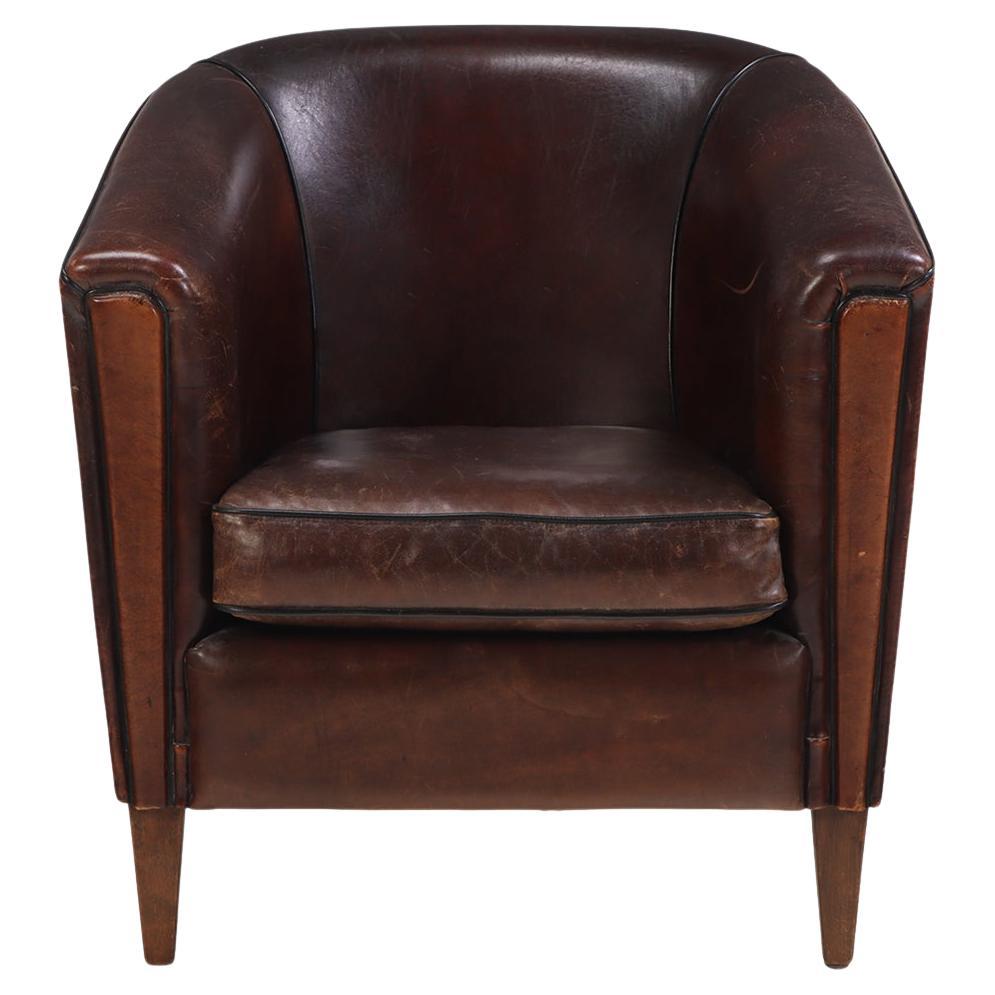 A.I.C., fauteuil club hollandais en cuir, C. 1960.