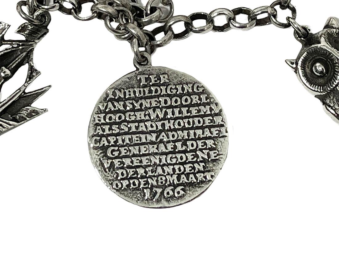 A Dutch mid-20th century silver large charms bracelet.

A silver charm bracelet of silver, consisting of 835/1000 purity of silver. Dutch hallmarked with the 