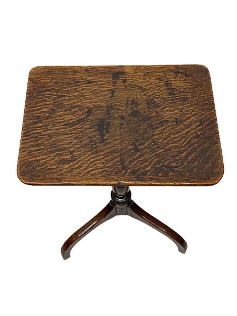A Dutch oak tripod tilt-top table, ca 1840.

A Dutch oak tripod rectangular tilt-top table on a turned stem raised on 3 curved legs. Dutch ca 1840. The surface of the blade has a beautiful wavy structure of the wood.

The measurement of the