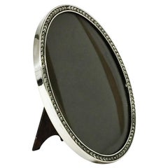 Dutch Oval Silver Photo Frame with Leaf Motif and Convex Hand Blown Glass