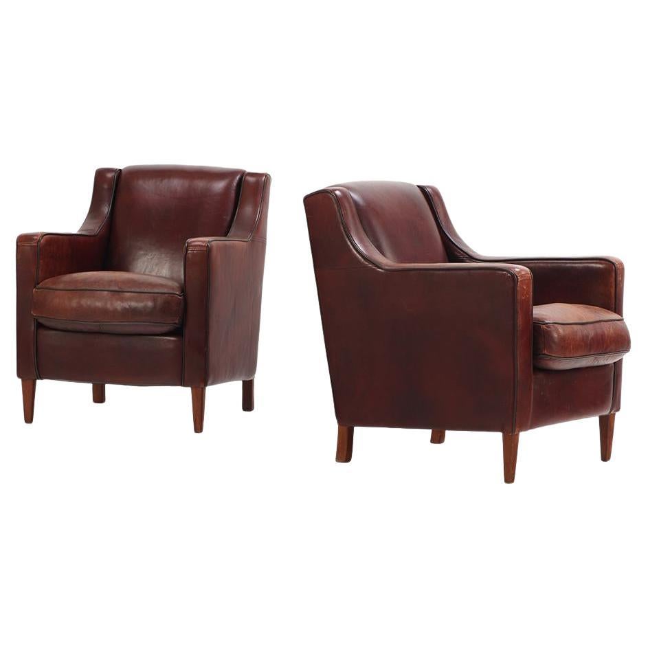 A Dutch pair of leather club chairs, C. 1960. For Sale