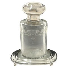 A Dutch perfume bottle on a coaster with silver, 1918