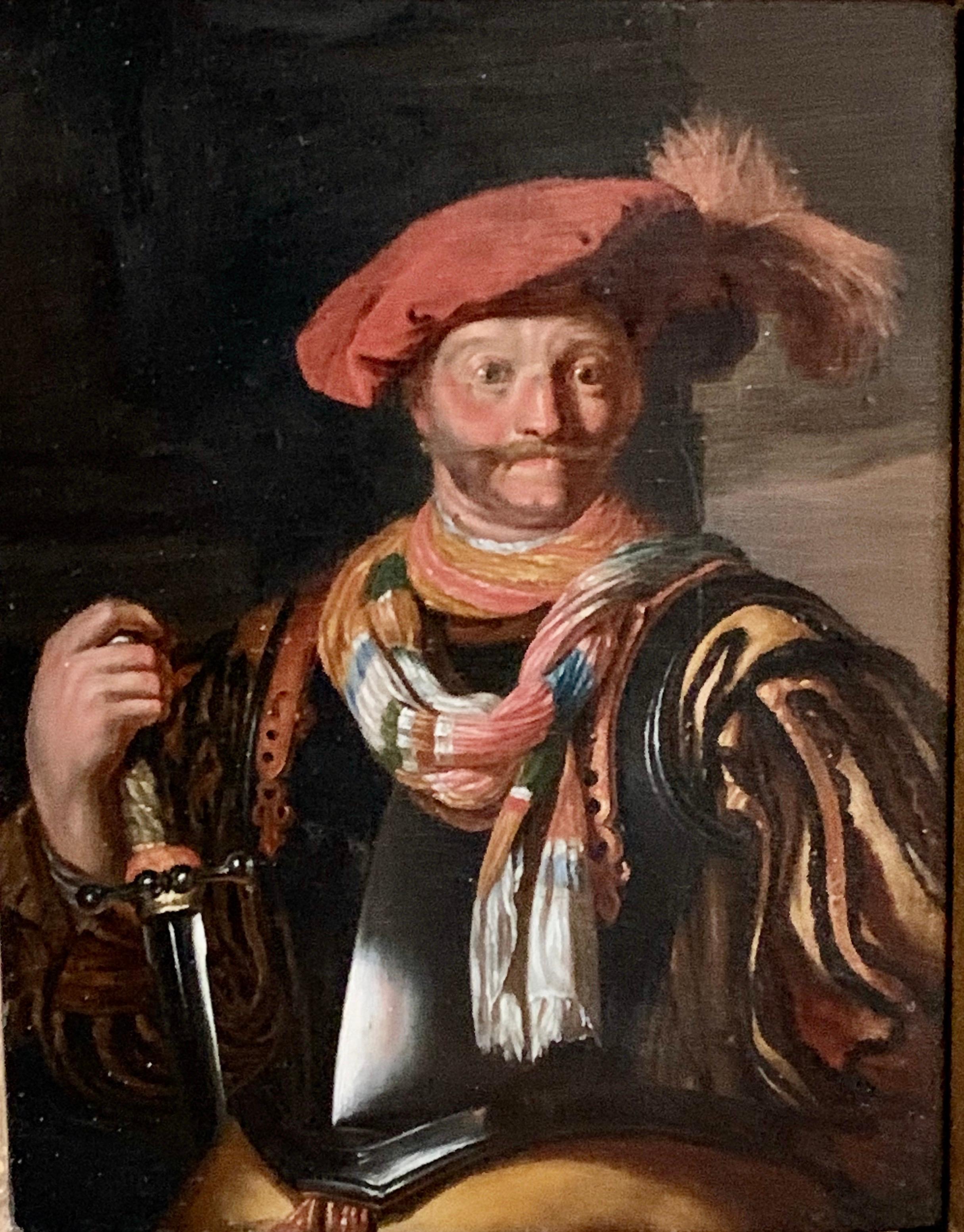 School of Haarlem circa 17th century
Portrait of a bearded gentleman, half length,
This looks like a portrait of the smiling Cavalier
Wearing a black shield a red Hat with a feather
He holds a sword and a colourful scarf.
A very nicely painted oil