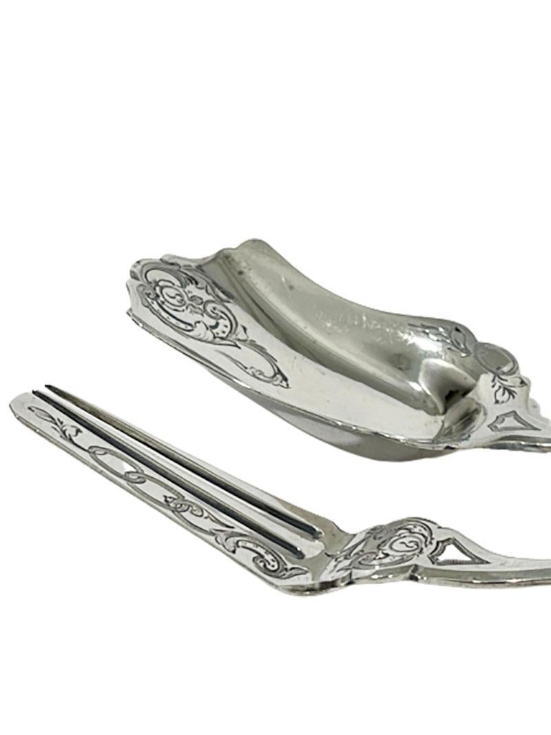A Dutch silver ginger place setting by Adrianus Kuijlenburg

A Dutch silver ginger place setting by Adrianus Kuijlenburg (1862-1882). 
The place setting has an elegant Biedermeier engraving on the front and is smooth on the back

Dutch Silver