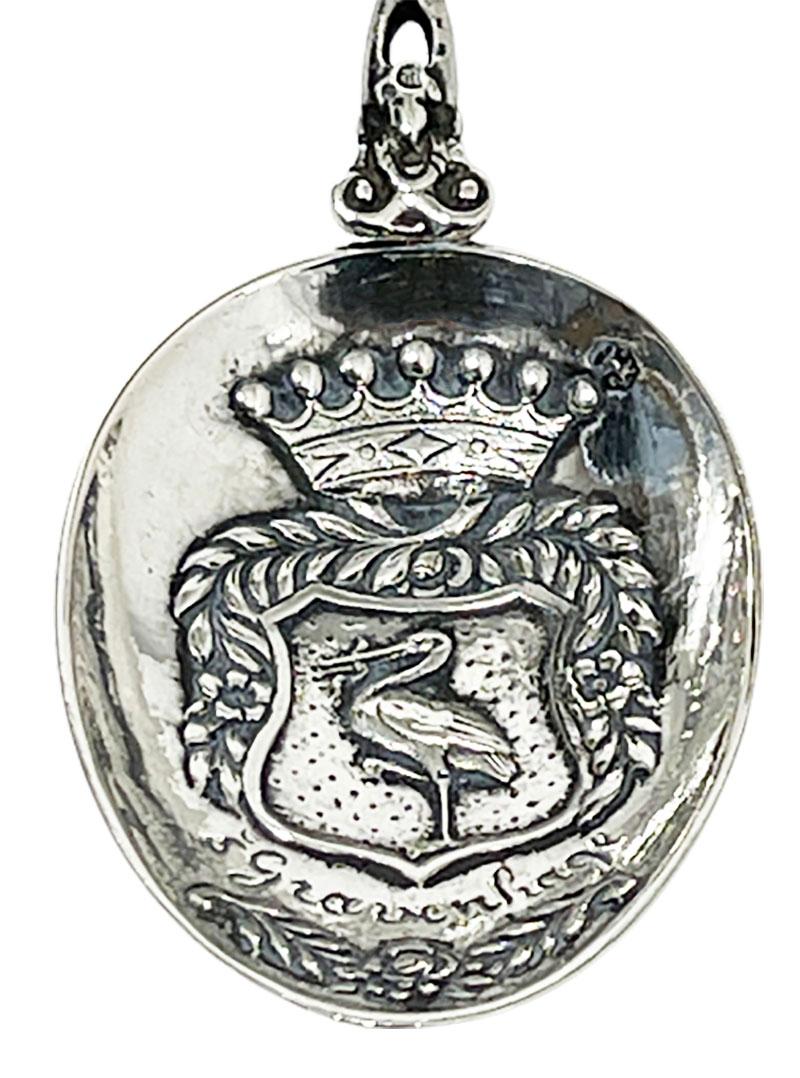 A Dutch silver occasional spoon with stork handle made by Gerardus Schoorl (1874-1914)
With The coat of arms of The Hague

Dutch Silver Hall marks of Lion 2 for 835/ 1000
Year letter U for 1904
Minerva head 
Master sign of Gerardus Schoorl (
