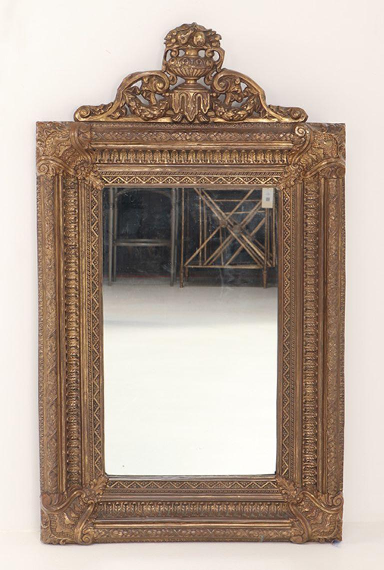 A  Dutch style brass repouse mirror circa 1880. The top crest is removeable for a more simple design.