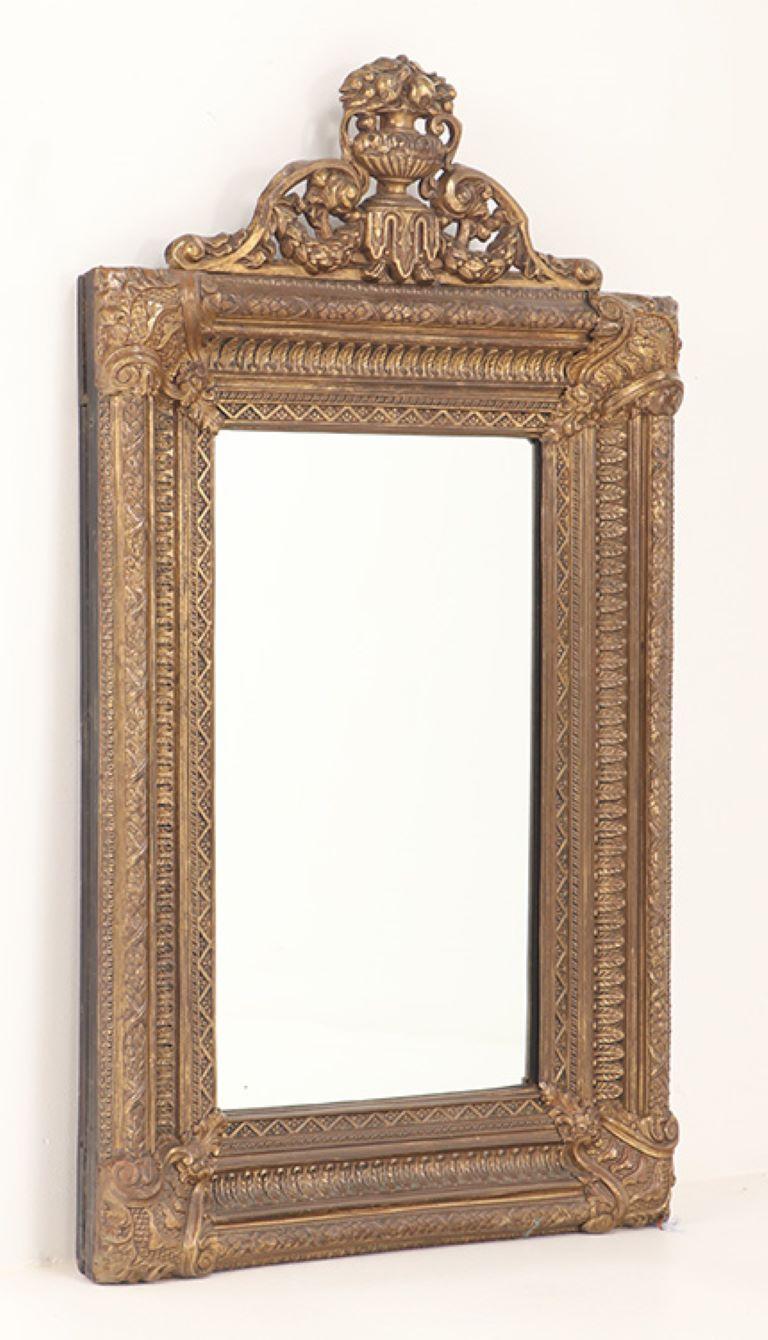 Baroque A Dutch style brass repouse mirror circa 1880. Top crest is removeable For Sale