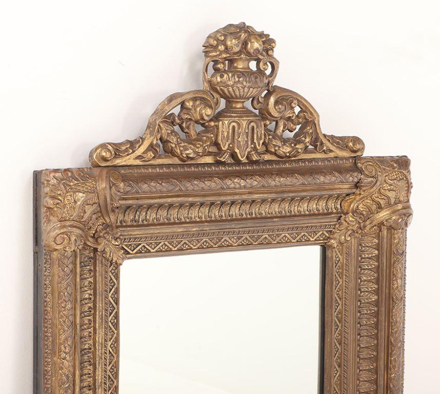 European A Dutch style brass repouse mirror circa 1880. Top crest is removeable For Sale