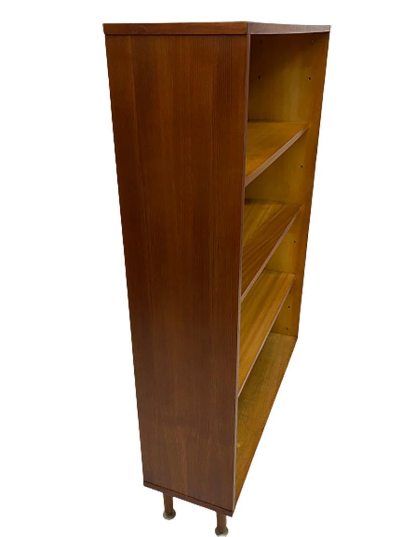 Dutch teak bookcase by Everest, Rotterdam, 1960s

This bookcase comes from a Dutch furniture factory in Rotterdam, the Everest. Made during the 60s with 4 compartment space with 3 shelves. The back wall in blue in the inside of the bookcase.