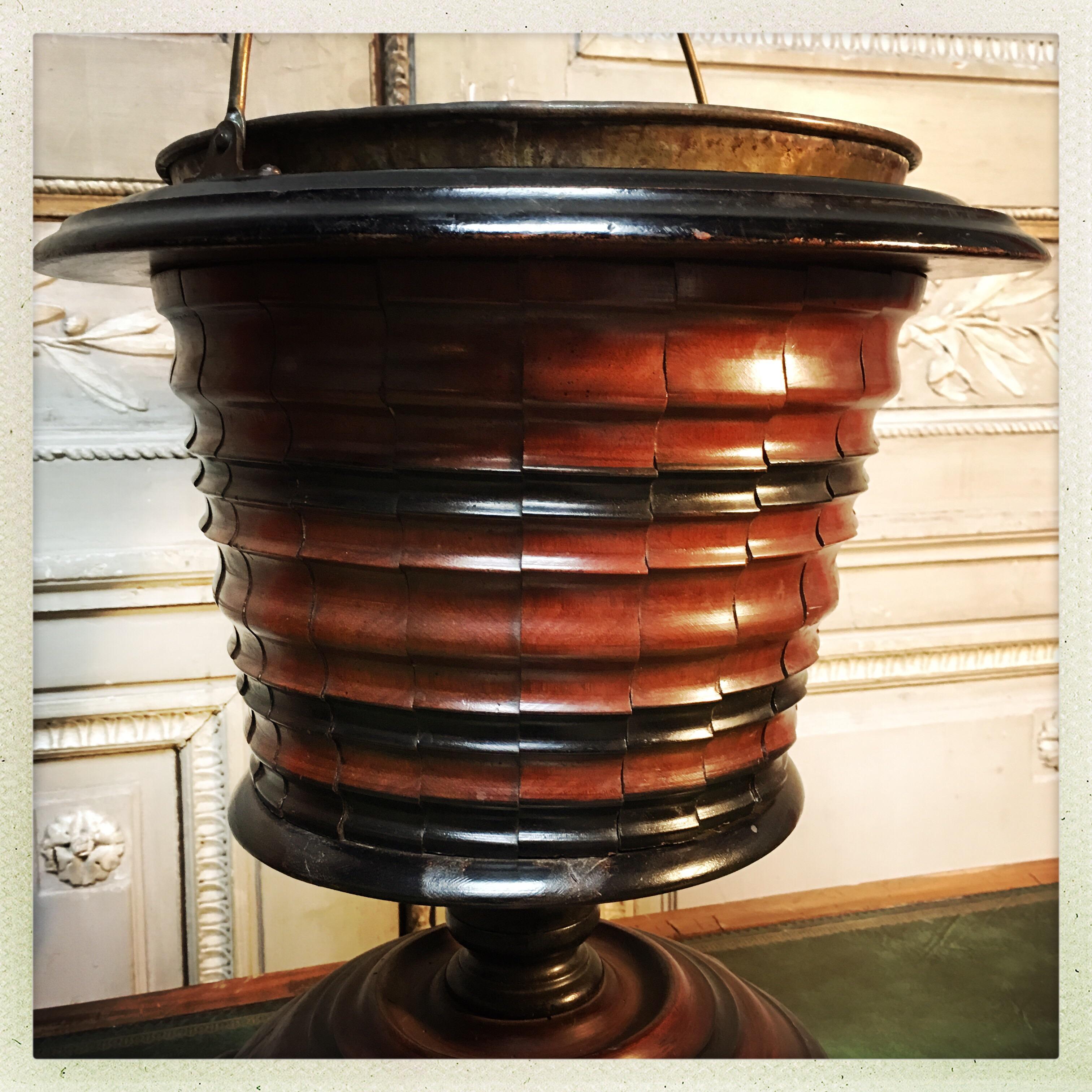 A Dutch walnut and ebonized walnut coal bucket with brass liner. Great planter or wine cooler.
