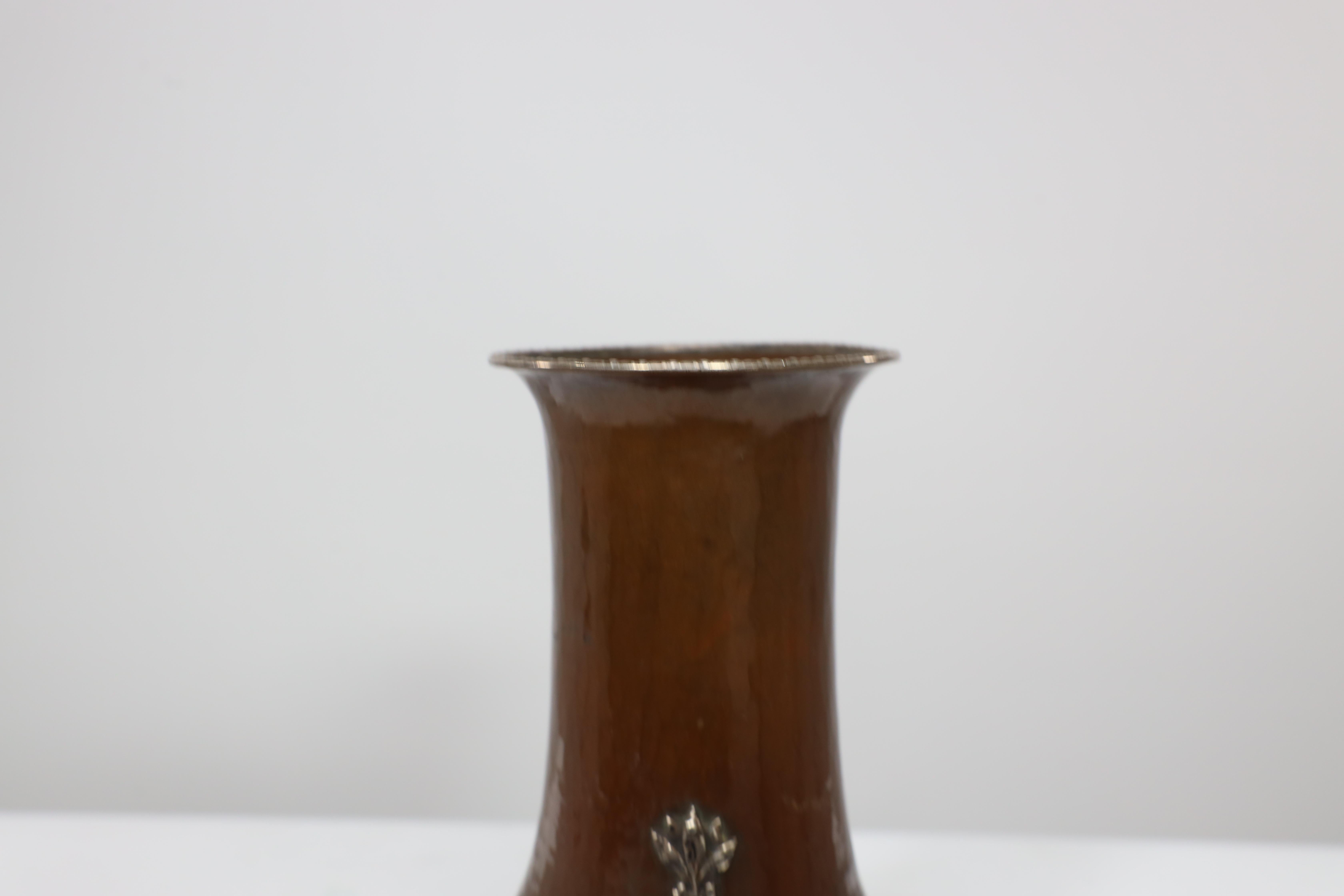 Early 20th Century A E Jones. A pair of hand-hammered copper vases with silver teardrop decoration For Sale