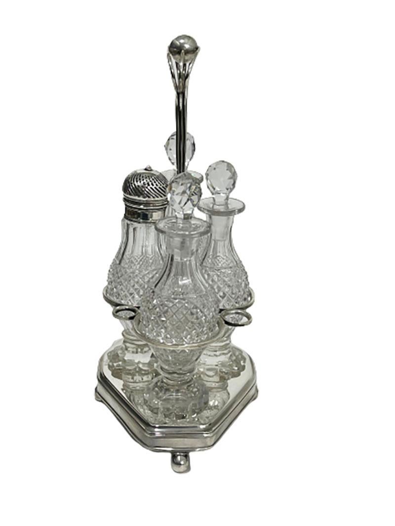 A early 19th century Dutch silver and diamond cut crystal cruet set, 1816

A silver standard with three diamond cut crystal bottles and a sprinkle bottle with silver CAP. Rectangular but oval shape with 8 corner base, raised at 4 ball feet. The
