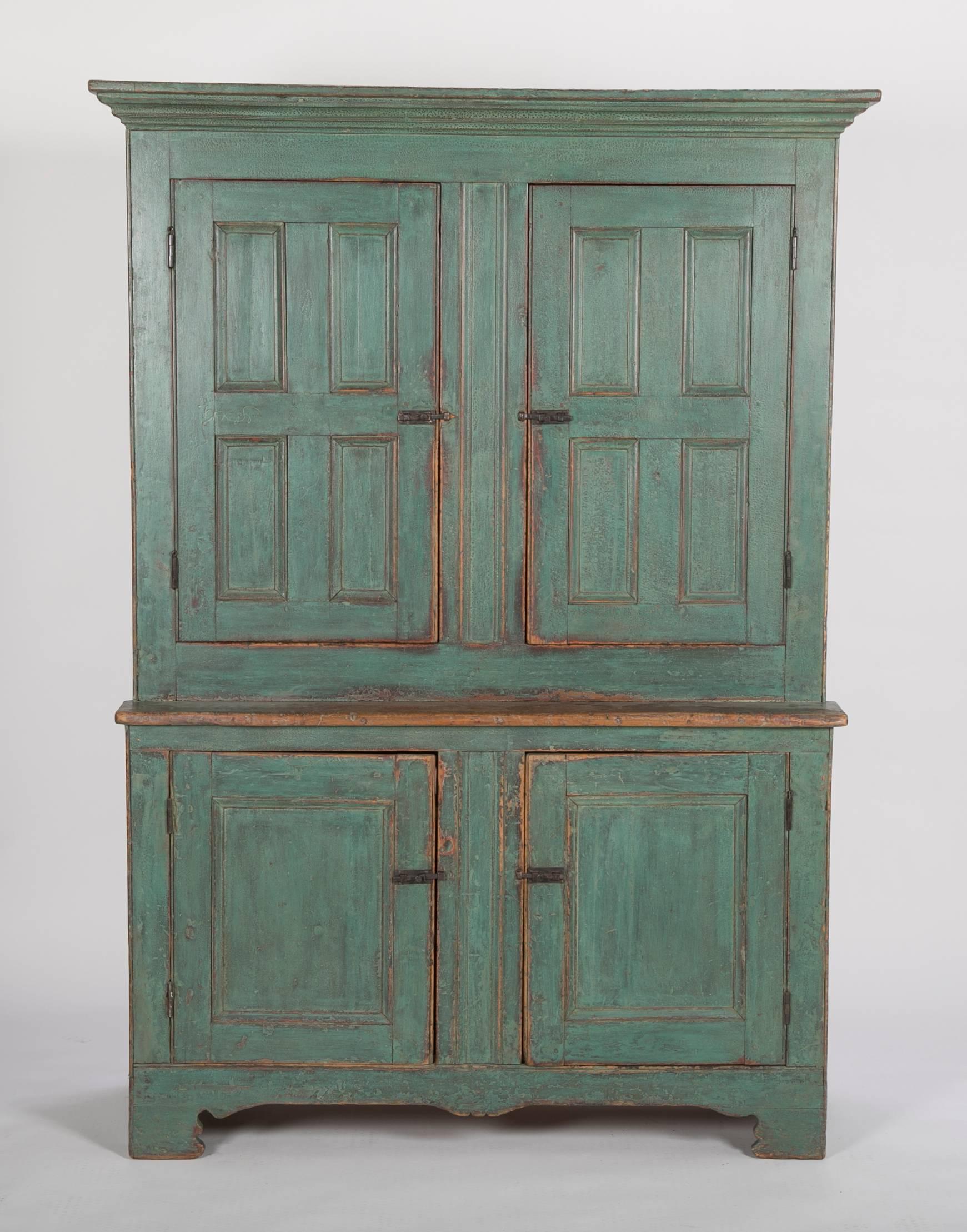 Handsome early American stepback cupboard in blue paint with great patina.