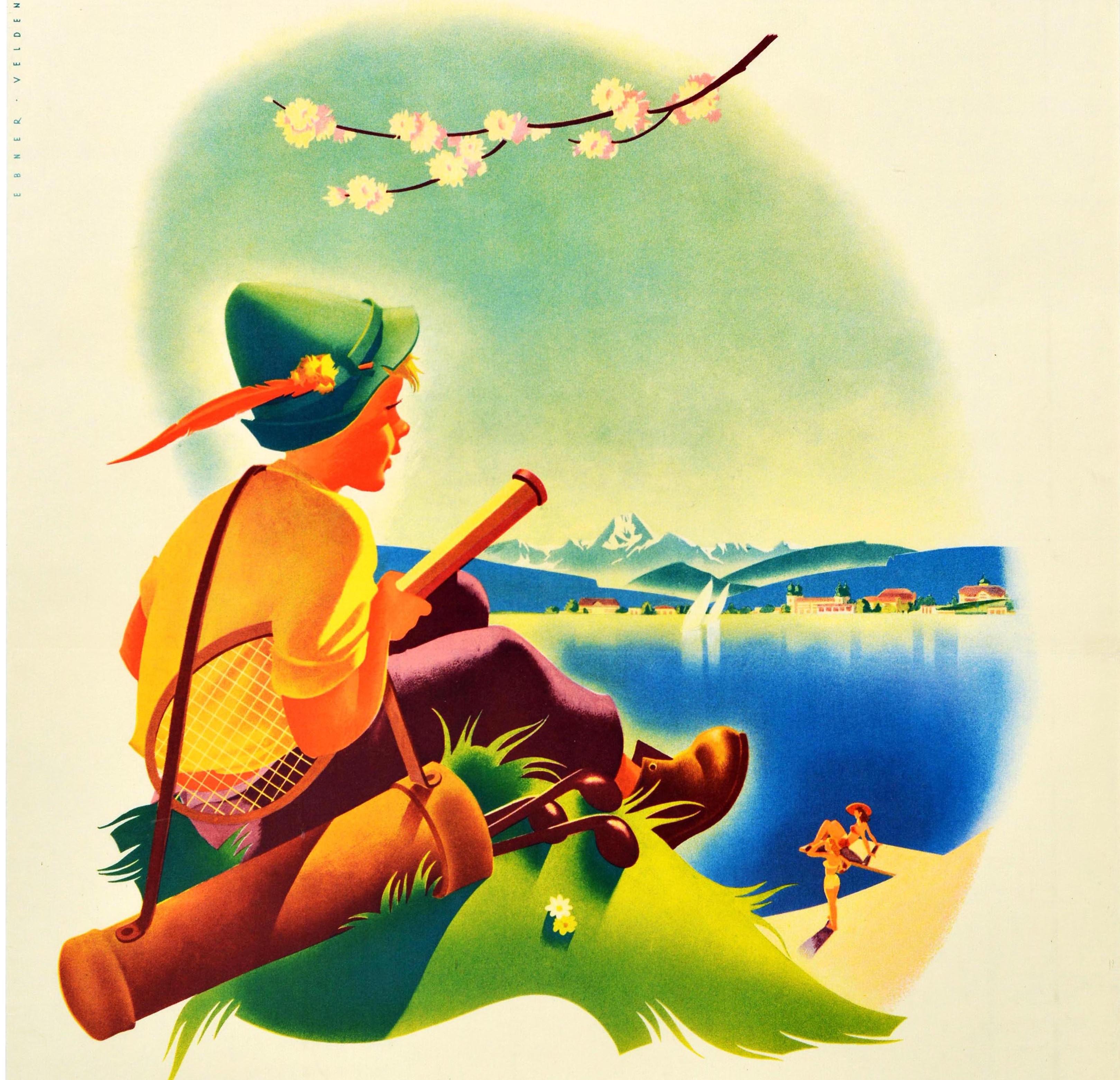 Original vintage travel poster promoting Velden Worther See - a market town on the shore of the Worthersee lake in Carinthia / Karnten Austria - showing a young boy in a traditional Austrian hat carrying golf clubs and a tennis racket on a grassy