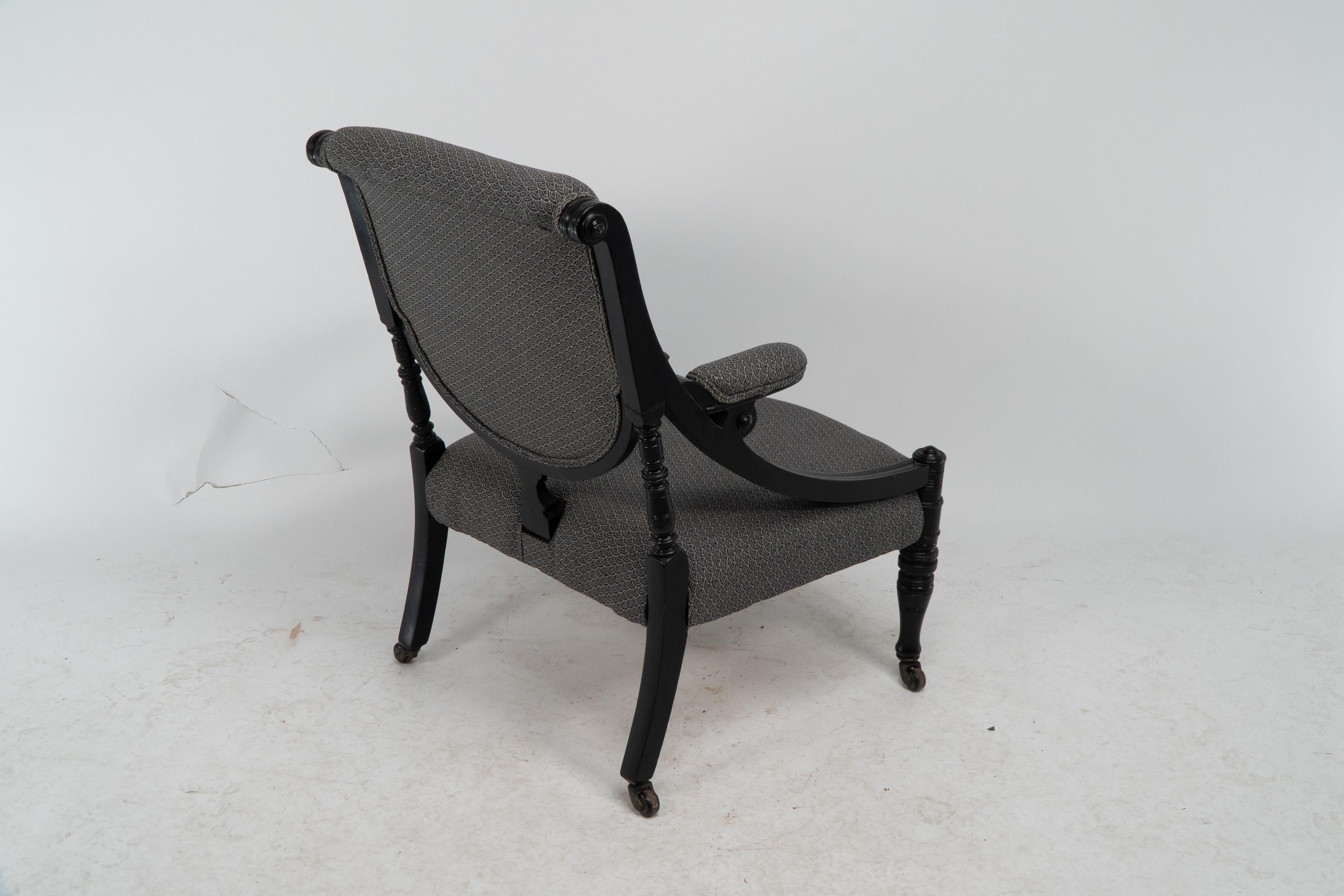 An Aesthetic Movement ebonized & upholstered armchair with sweeping side rails. For Sale 13