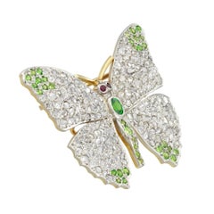 A Edwardian diamond and demantoid garnet butterfly brooch