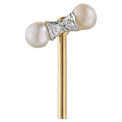 A Edwardian diamond and pearl stick pin