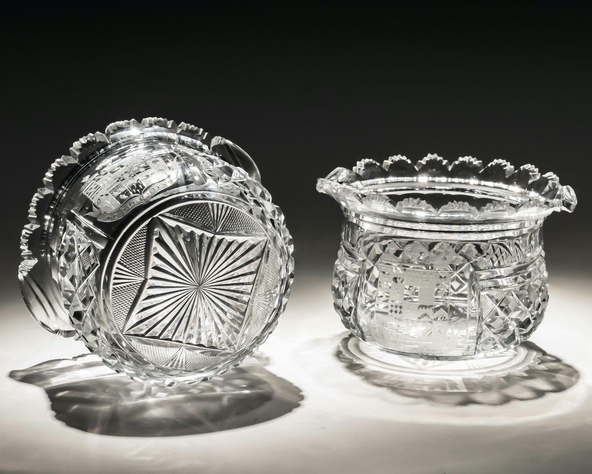 This exceptional suite of Regency cut glass, consisting of pairs of elaborately cut decanters, bucket bowl goblets and wine rinsers. All are finely engraved to the front panel with the full coat of arms of John George Lambton, with the family motto