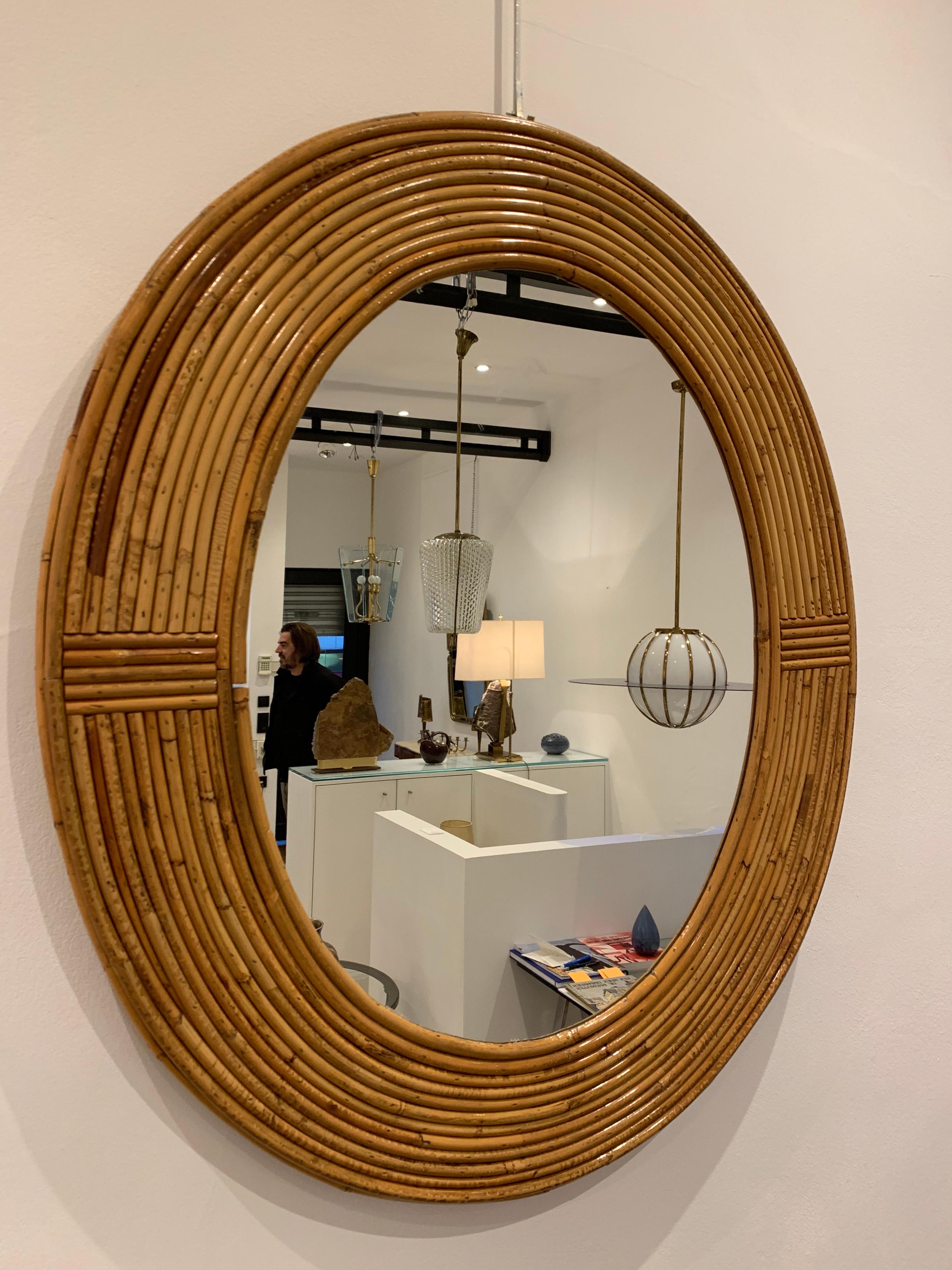 Vivai Del Sud is an Italian furniture company which designed and produced furniture in Rattan and Bamboo. 

The present mirror dates circa 1960s. This type of mirror is typical of the trend for rattan furniture in the 1960s-1970s. 

Famous