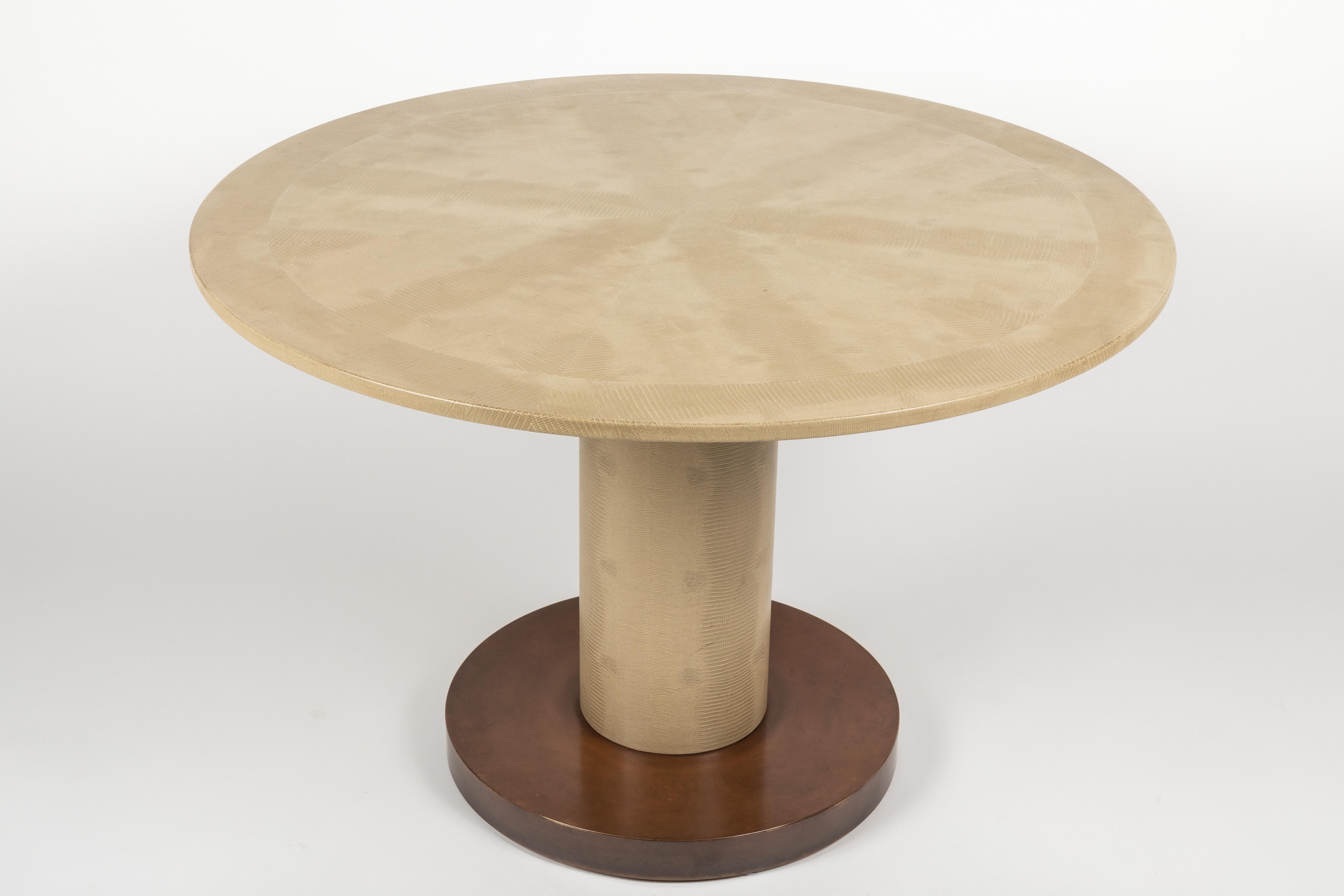 This table, attributed to Karl Springer is an example of quality workmanship. Acquired from a home that included several signed pieces by Springer it seems reasonable that this table is most likely his work. Both the top and column are veneered in