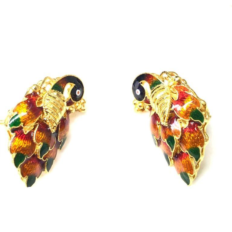 Enamel peacock earrings in 22Kt gold.