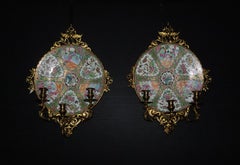 A Exceptional Pair of Famille Rose Canton Plates, now turned into wall sconces.