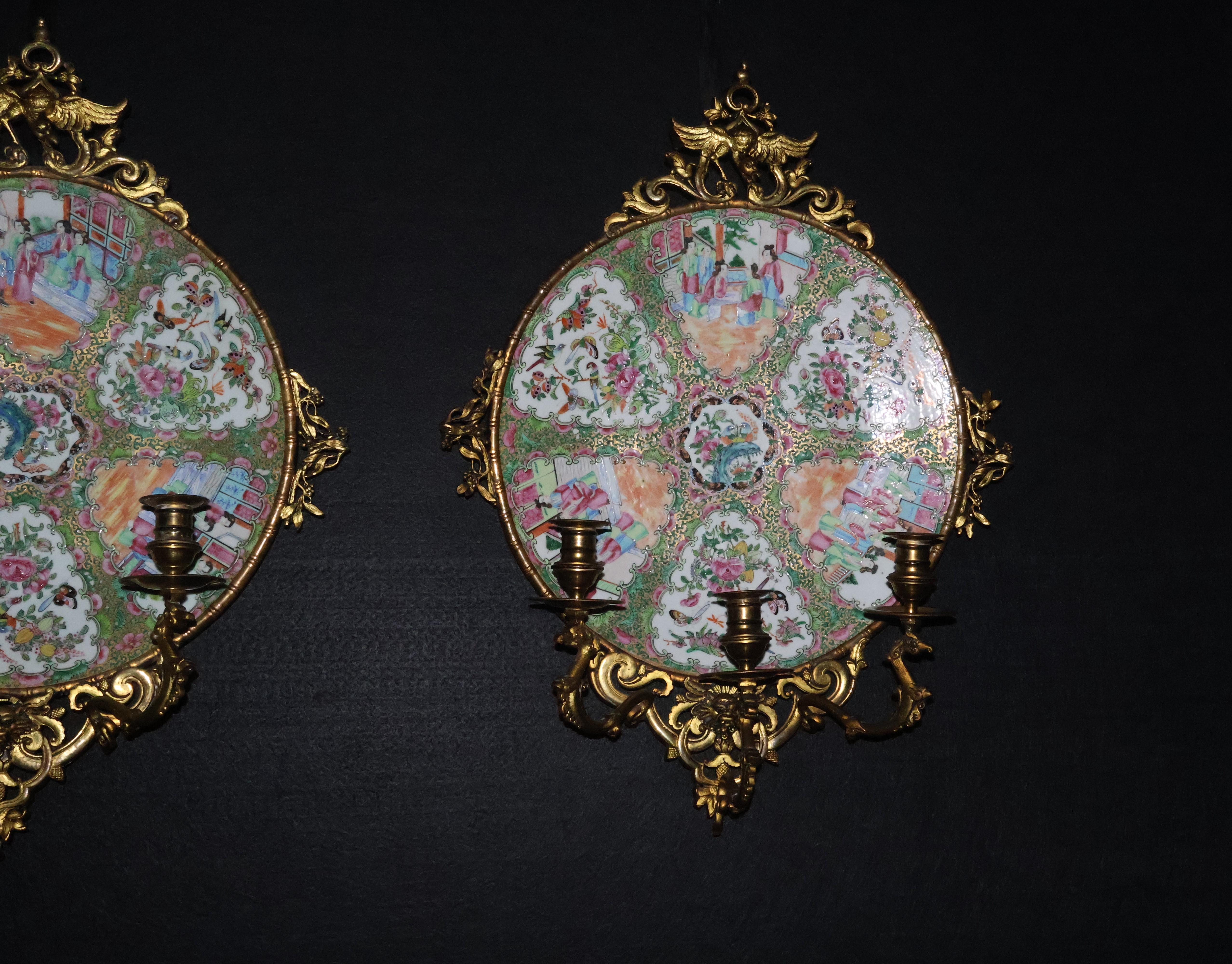 A Exceptional Pair of Famille Rose Canton Plates, now turned into wall sconces.  In Good Condition For Sale In Atlanta, GA