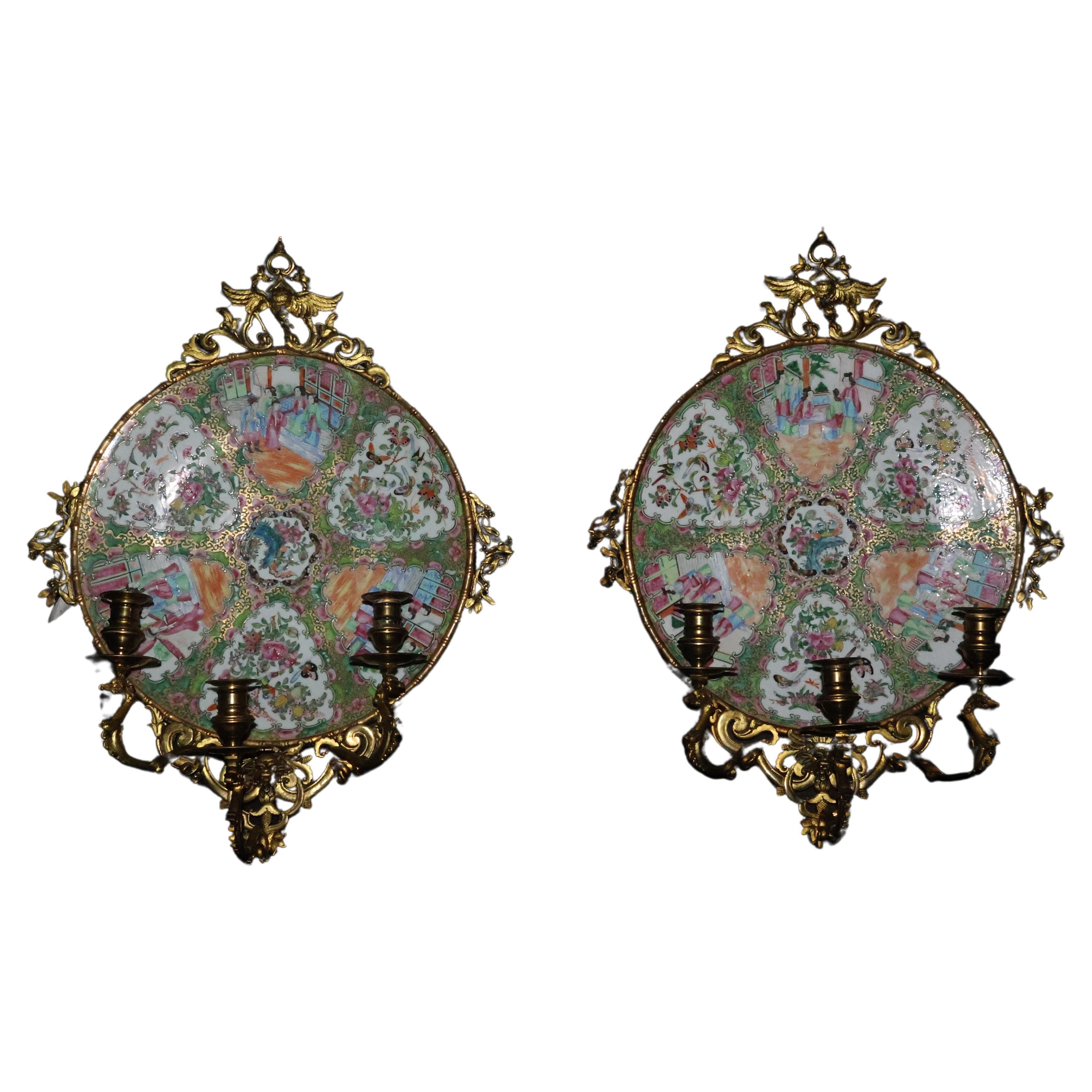 A Exceptional Pair of Famille Rose Canton Plates, now turned into wall sconces.  For Sale