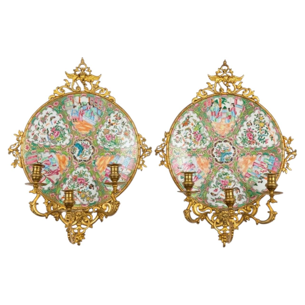 A Exceptional Pair of Famille Rose Canton Plates, now turned into wall sconces. For Sale