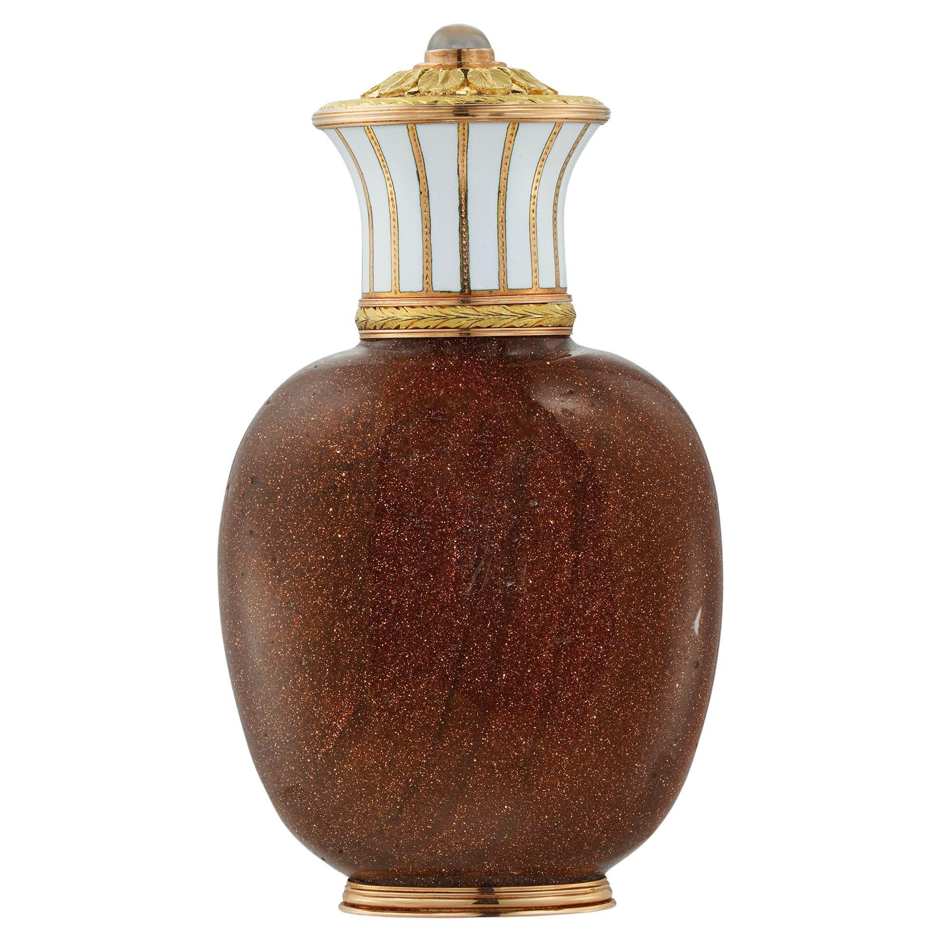 A Fabergé goldstone-glass and enamel scent bottle