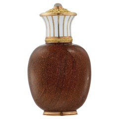 A Fabergé goldstone-glass and enamel scent bottle