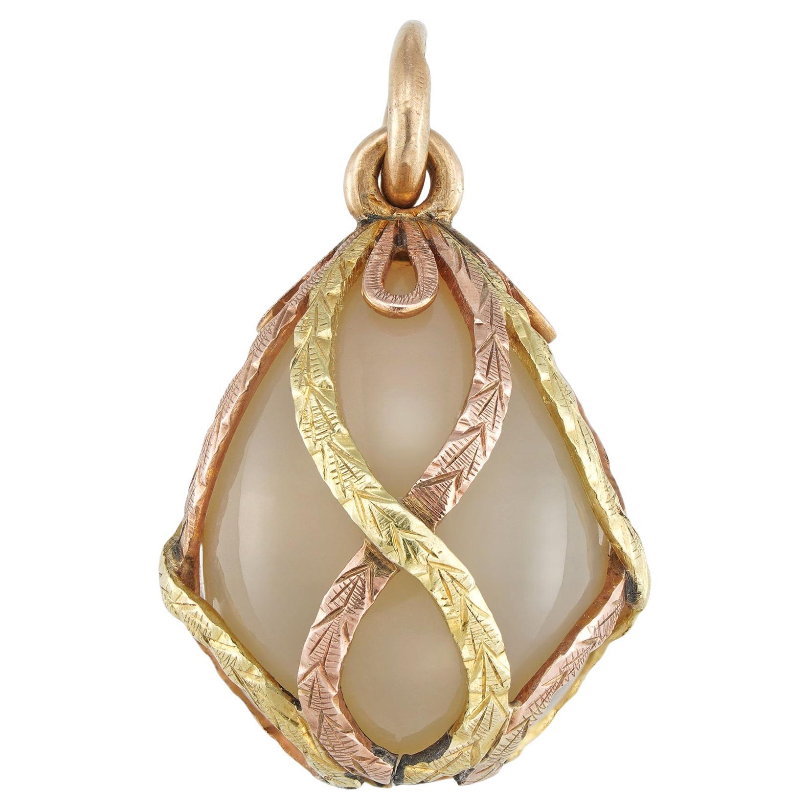 A Fabergé Varicoloured Gold And Moonstone Easter Egg Pendant For Sale