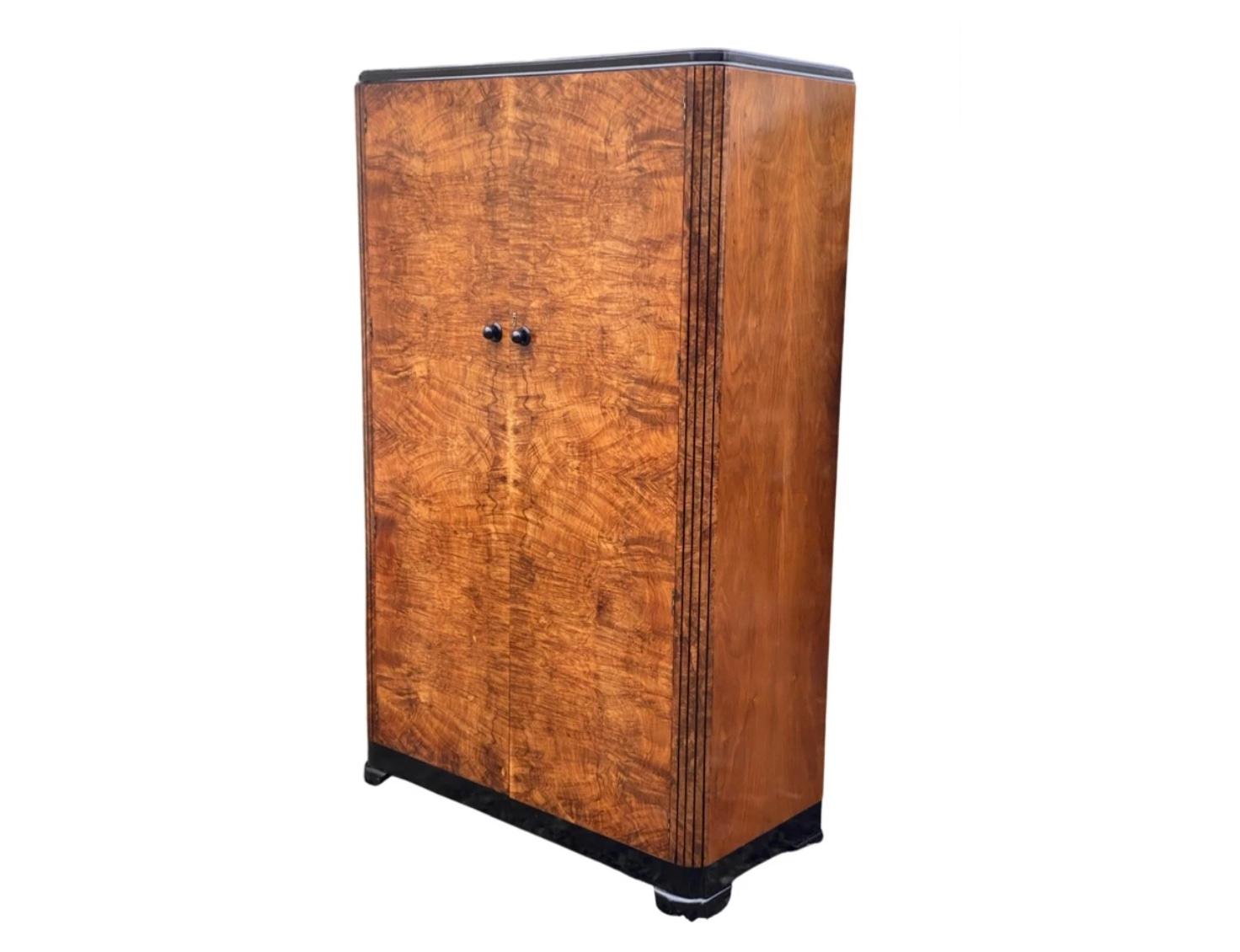 New in is this fabulous Art Deco 2 door wardrobe, veneered in the most amazing “oyster” veneers. Complementing the rich warm honey colours of the veneers to the sides and front are ebonised accents. These are the plinth, the cornice, the 2 original