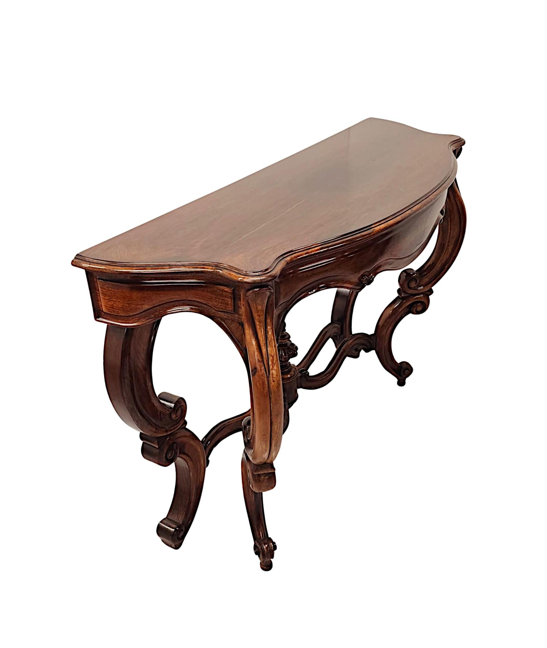 A fabulous 19th Century fruitwood console table of exceptional quality, finely hand carved with gorgeously rich patination and fine grain.  The well figured moulded, serpentine top of rectangular form raised over shaped single drawer frieze with
