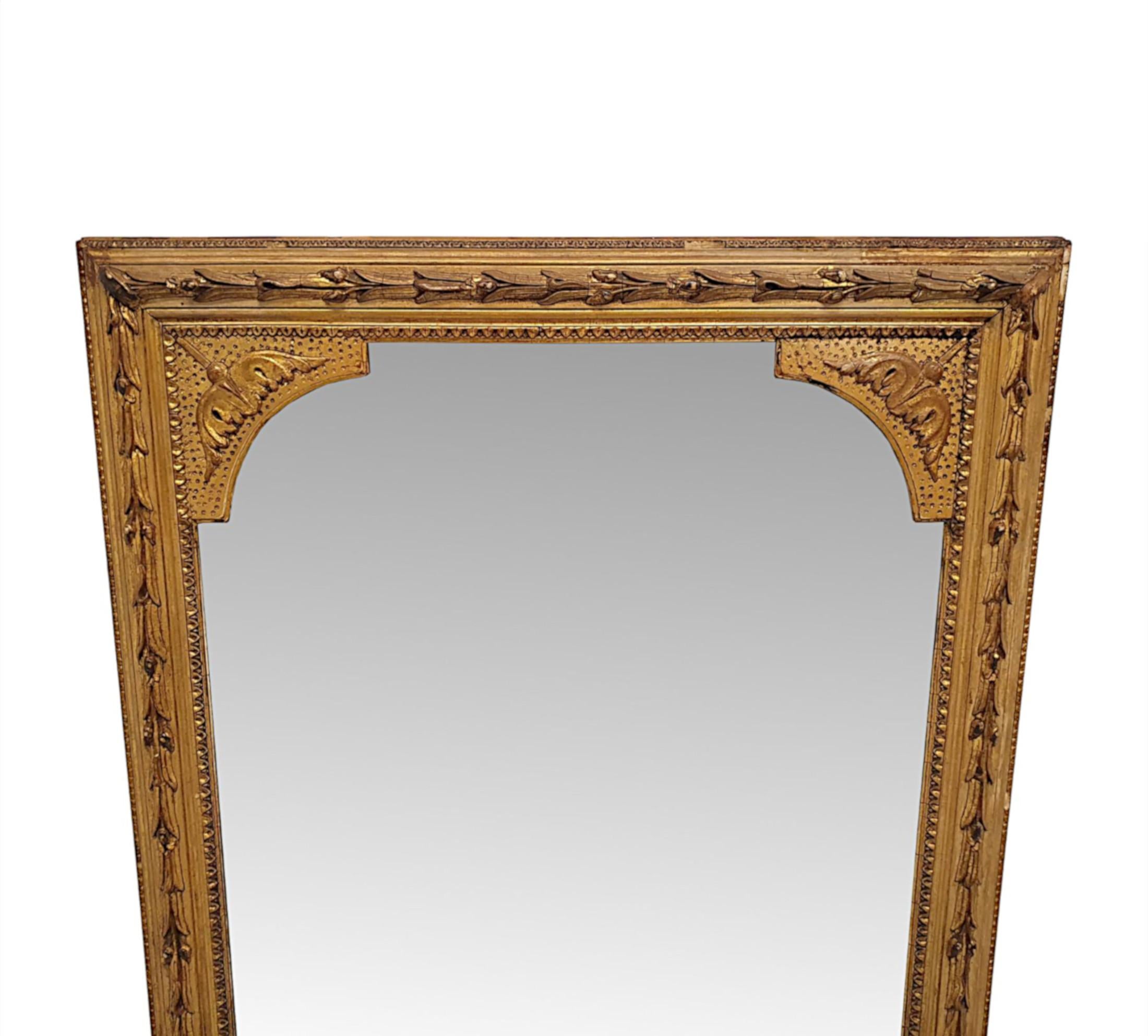 A fabulous 19th Century giltwood pier or dressing mirror of tall and narrow proportions and in lovely original untouched condition.  The gorgeous sparkly mercury mirror glass plate of shaped rectangular form is set within a finely hand carved,