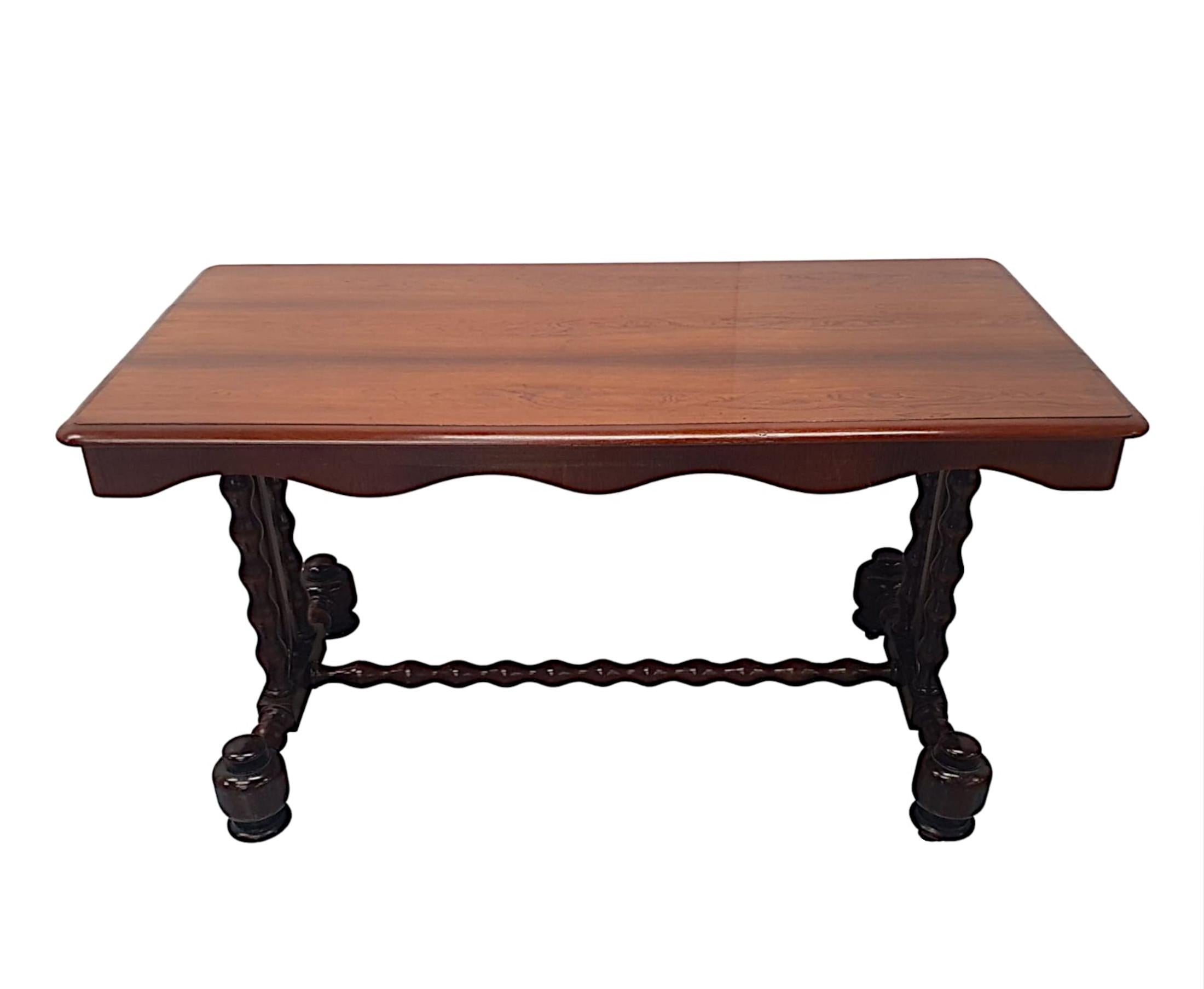 A fabulous 19th century fruitwood library table desk finely hand carved with gorgeously rich grain and patination. The moulded top of rectangular form raised over scalloped frieze above elegant turned bobbin end supports conjoined with bobbin