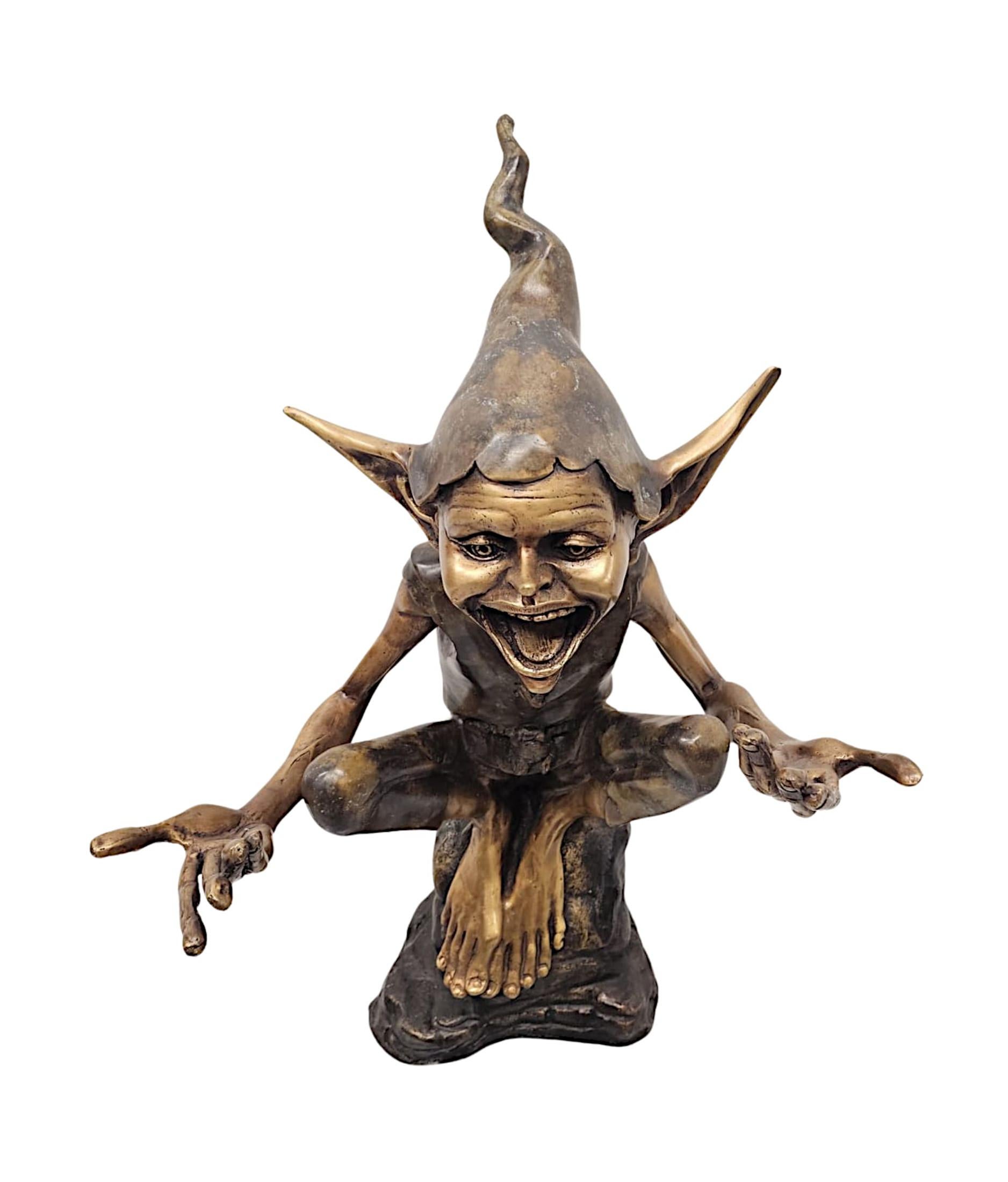 A fabulous 20th Century figurative bronze garden statue of a goblin perched atop a rock, of exceptional quality and finely cast with stunning detail and patination.