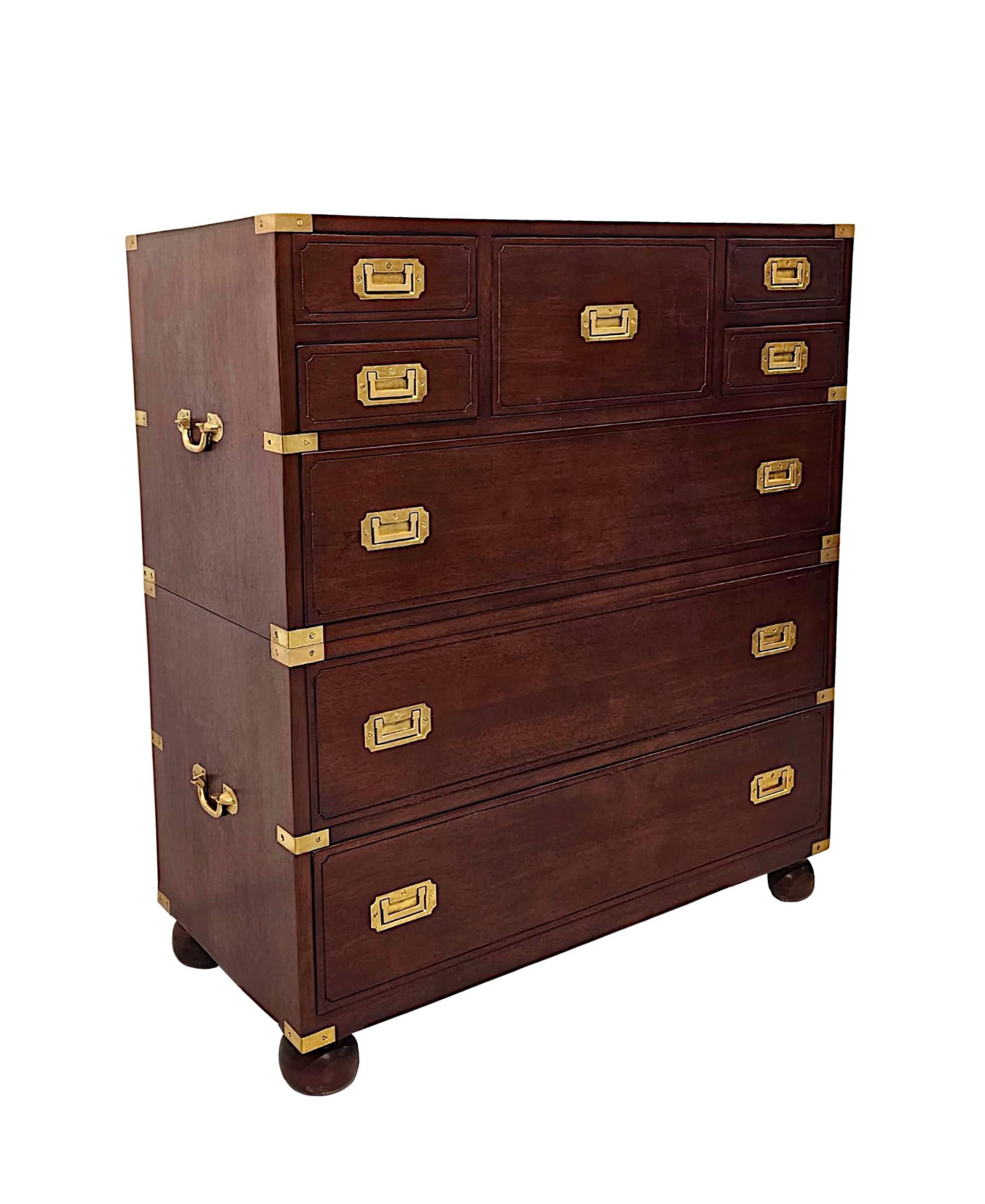 A fabulous cherrywood chest of drawers in the campaign style, of exceptional quality, finely hand carved, brass mounted throughout and with gorgeously rich patination and grain.  The well figured moulded top of rectangular form is framed with