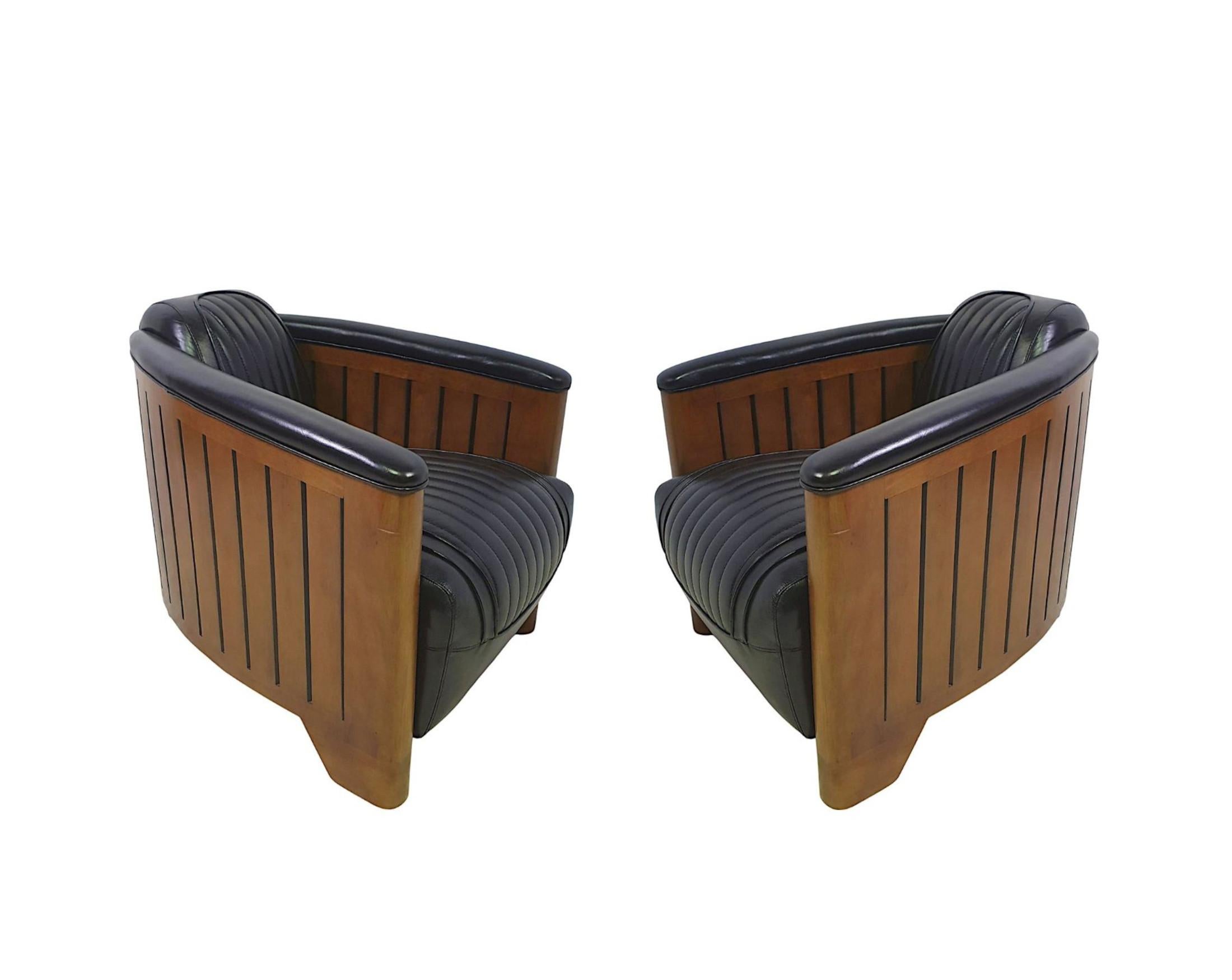 A fabulous handmade leather and well figured cherrywood framed club armchair in the Art Deco style of exceptional quality with gorgeously rich patination and grain.  This stunning piece is beautifully upholstered in elegant black leather with