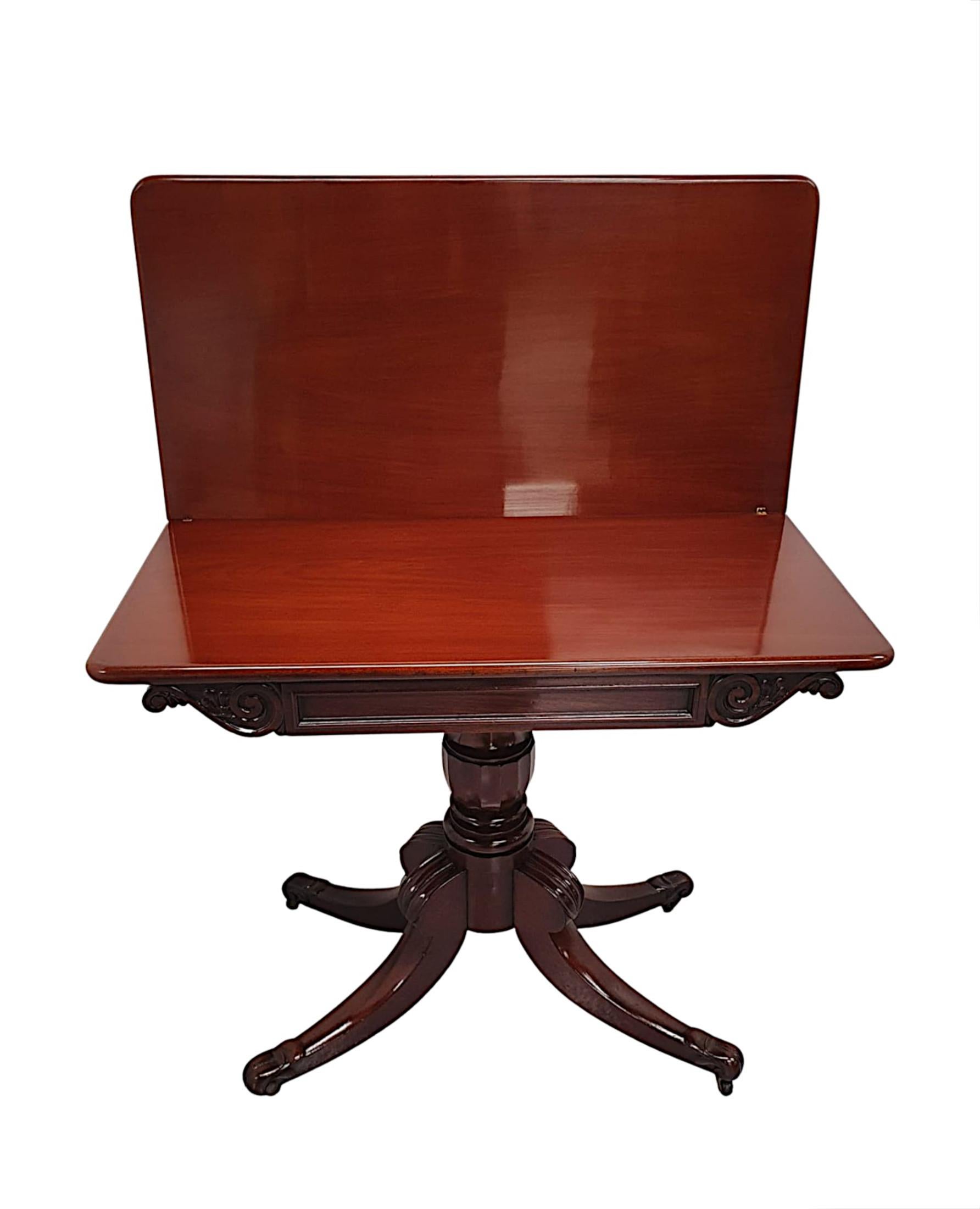 A fabulous early 19th Century Irish Regency mahogany turn over leaf tea  table, finely hand carved and of exceptional quality with rich patination and grain.  The well figured, moulded hinged top of rectangular form is crossbanded with rosewood and