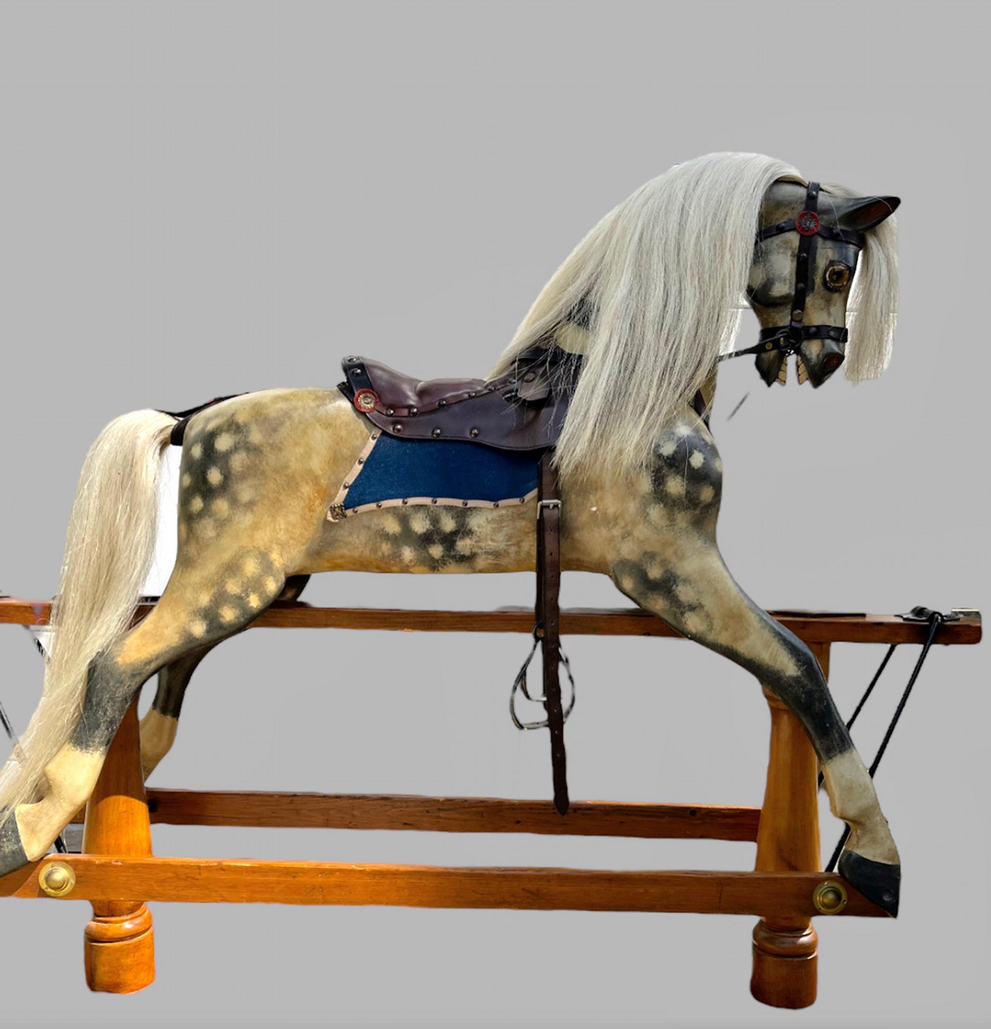 A Fabulous Pillar Stand Rocking Horse c 1880 , although no makers mark in considered opinion of expert in Rocking Horses its similar in construction to BCL (Liverpool Victorian Firm) but the detail carving and painting is superior.

The Rocking
